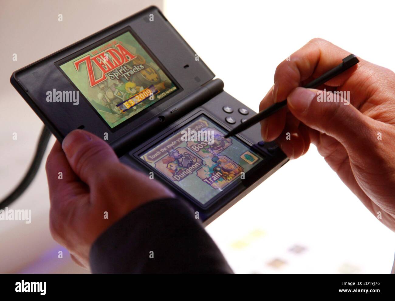 A visitor plays The Legend of Zelda: Spirit Tracks video game on the  Nintendo DS during the Electronic Entertainment Expo or E3 in Los Angeles  June 3, 2009. The convention runs June