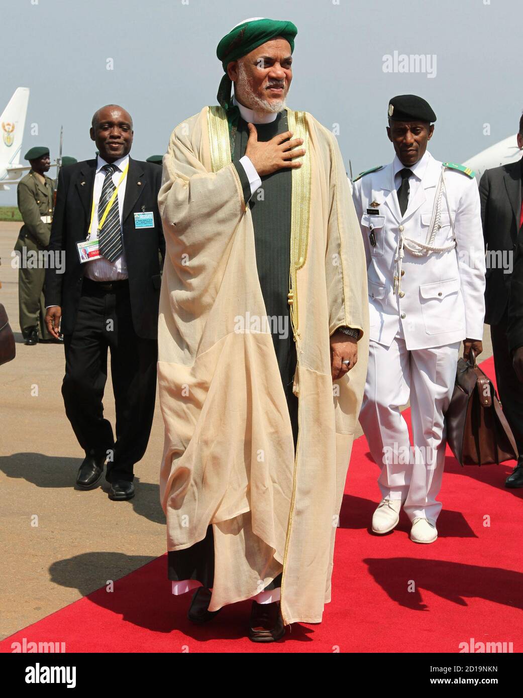 Comoros President Abdullah Muhamed Sambi (C) arrives at the airport in Entebbe 42km (26 miles) south of Uganda's capital Kampala, July 24, 2010. Sambi is in Uganda to attend the African Union summit.  REUTERS/James Akena (UGANDA) Stock Photo