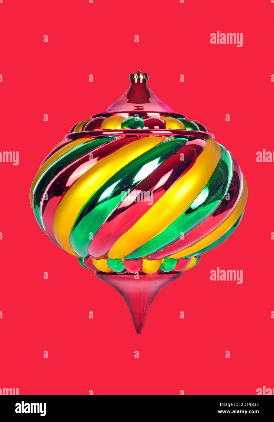 A Beautiful and Colorful Christmas Ornament Isolated on a Red Backgound Stock Photo
