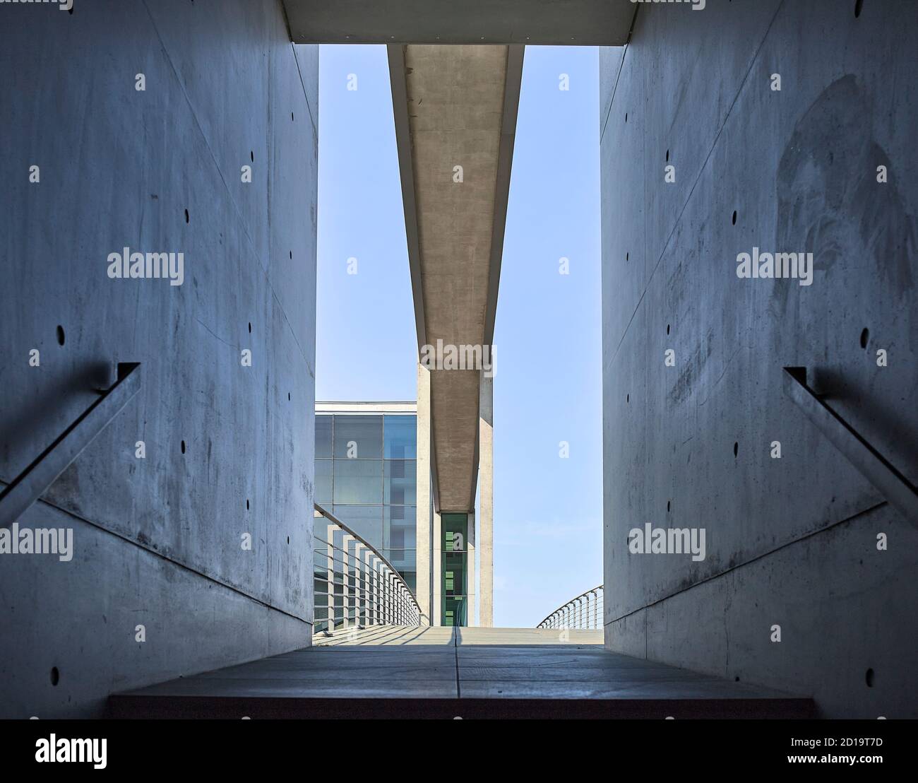 Low angle point of view of the door frame of the staircase and empty Pedestrian Bridge at the Berlin's government district Stock Photo