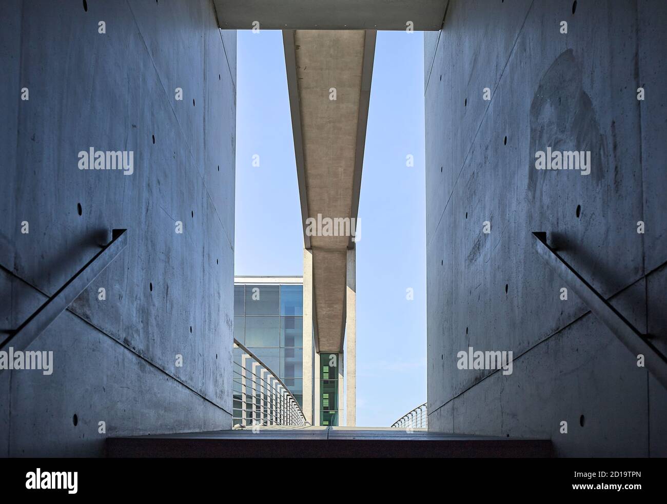 Low angle point of view of the door frame of the staircase and empty Pedestrian Bridge at the Berlin's government district Stock Photo