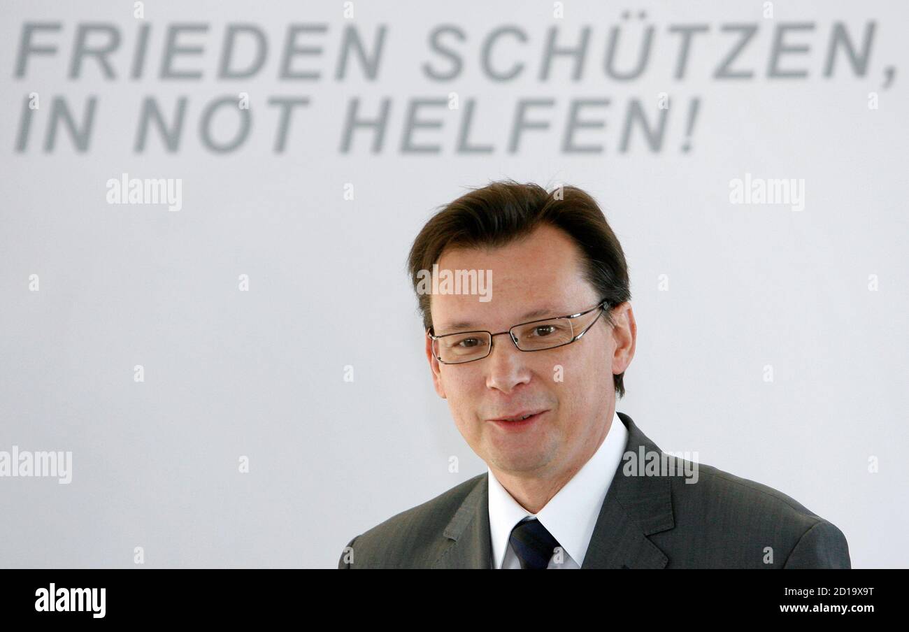 Minister for National Defence Norbert Darabos smiles during a conference in Vienna November 27, 2007. 'Frieden schuetzen, in Not helfen' reads 'Preserve peace, help in need'.  REUTERS/Herbert Neubauer  (AUSTRIA) Stock Photo