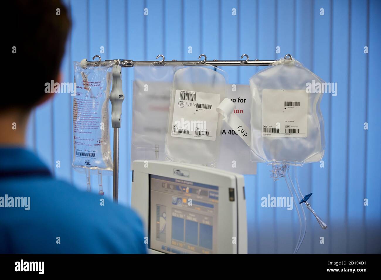 NHS blood donor centre Plasma donation, Plasma the largest single component of blood a clear, straw-coloured liquid,  carries platelets, red and white Stock Photo