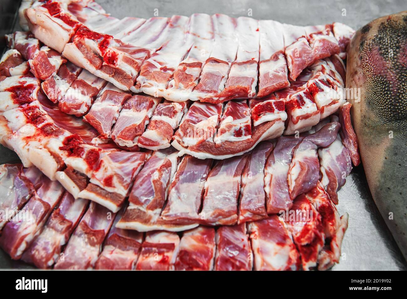 Selection of quality meat in a butcher shop. Different types of fresh meat are on display. Meat