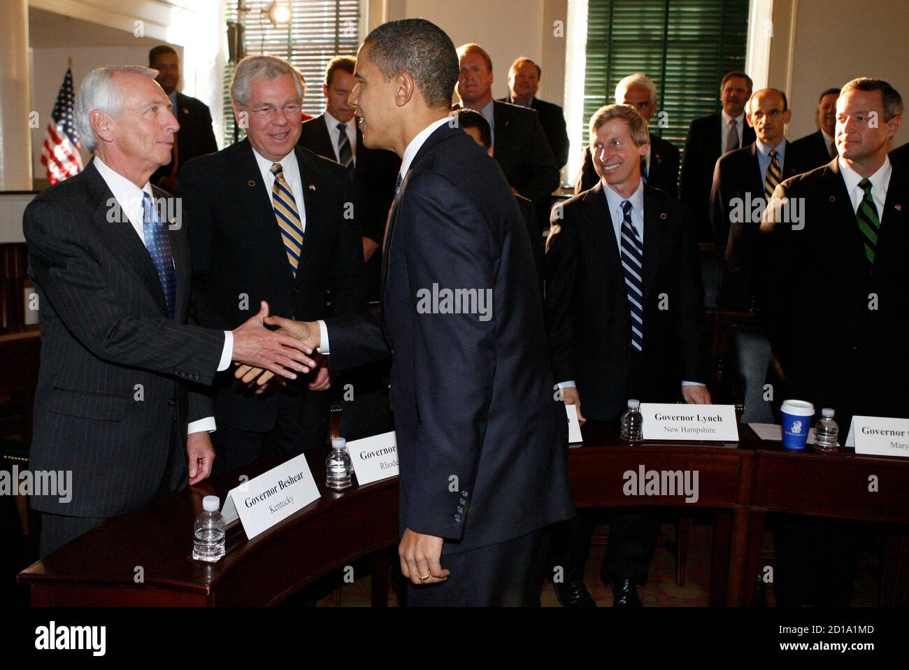U.S. President-elect Barack Obama (R) shakes hands with Kentucky Governor Steve Beshear before a bipartisan meeting with members of the National Governors Association at Congress Hall in Independence Park in Philadelphia, Pennsylvania December 2, 2008. REUTERS/Jeff Haynes (UNITED STATES) Stock Photo