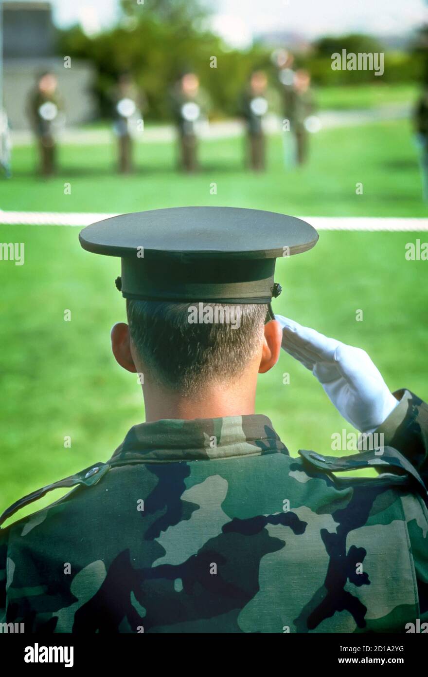 Marine officer salutes the honor guard at the Iwo Jima statue at Arilington Cemetary Virginia Stock Photo