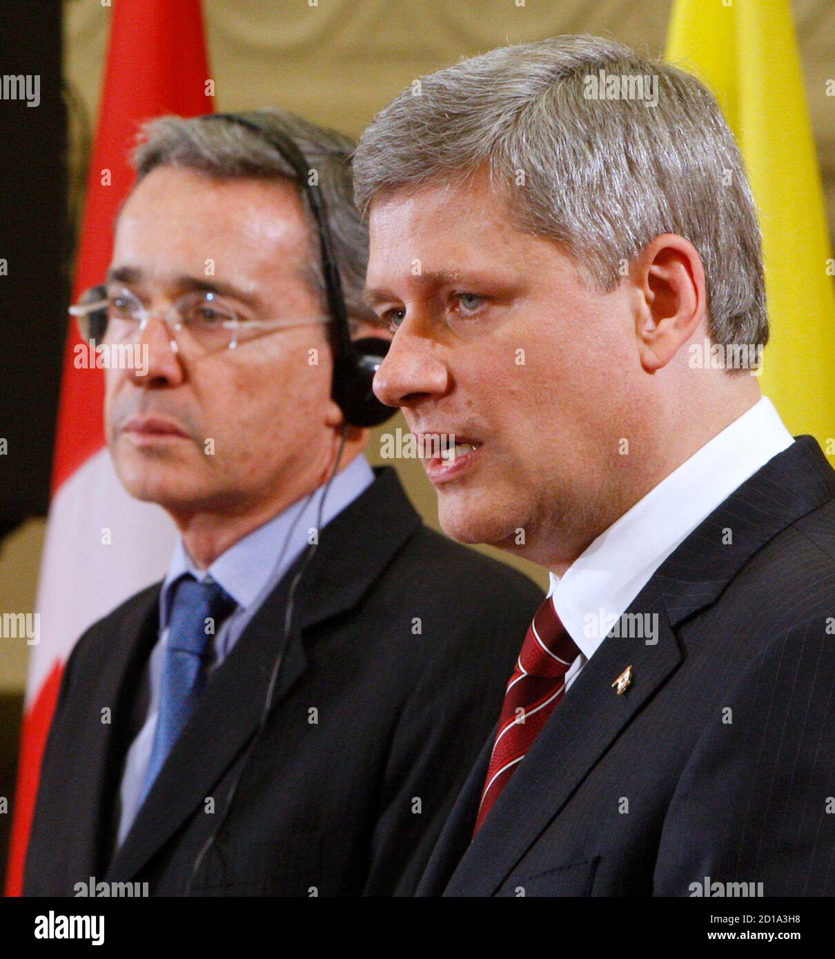 Canada's Prime Minister Stephen Harper (R) speaks during a news conference with Colombia's President Alvaro Uribe on Parliament Hill in Ottawa June 10, 2009.       REUTERS/Chris Wattie       (CANADA POLITICS) Stock Photo