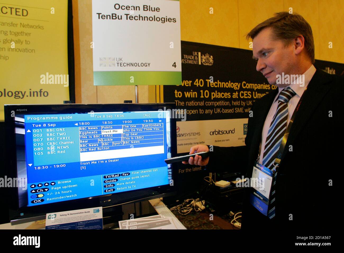 Peter Boyt, engineering director for the British-based Ocean Blue Software, demonstrates a television with a talking program guide for the visually impaired during 'CES Unveiled,' a media preview event, at the 2010 International Consumer Electronics Show (CES) in Las Vegas, Nevada January 5, 2010. The software would be incorporated by manufacturers into set top boxes, Boyt said. CES, the world's largest consumer technology trade show, runs from January 7-10.REUTERS/Steve Marcus (UNITED STATES - Tags: BUSINESS SCI TECH) Stock Photo