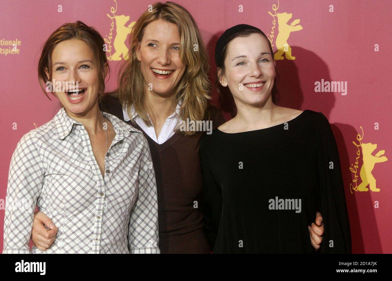 German director Vanessa Jopp (C) poses with German actresses Meret Becker (R) and Stefanie Stappenbeck during a photocall to present their film 'Komm Naeher' ('Happy as One') running out of competition at the 56th Berlinale International Film Festival in Berlin February 16, 2006. The festival runs from February 9-19. Stock Photo