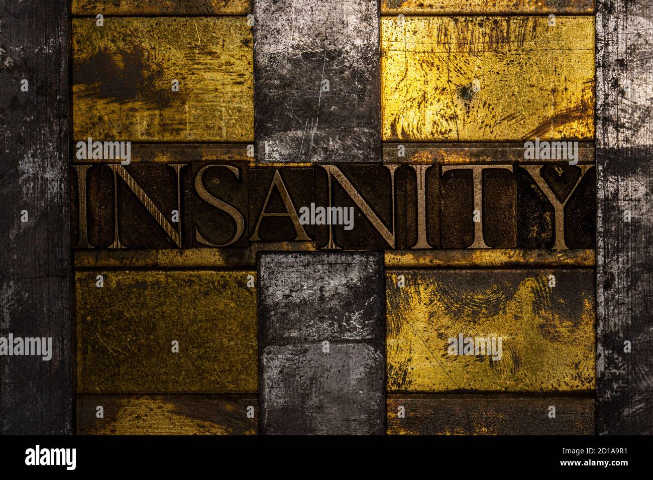 Insanity text message with barbed wire on textured grunge copper and vintage gold background Stock Photo