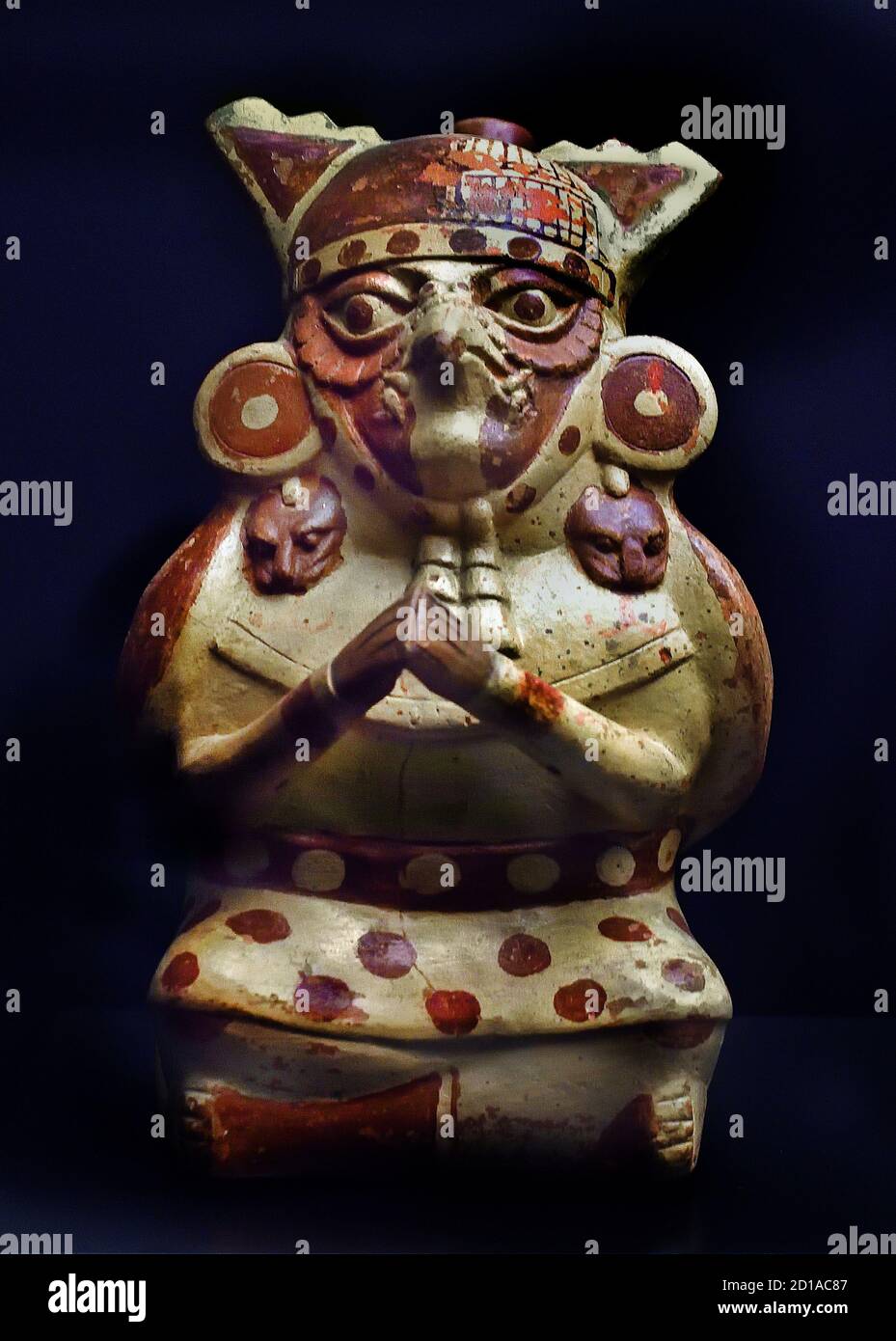 Anthropomorphic figure represents a deceased with a jade tale between his teeth to pay for the trip to the world of the dead Moche or Mochica 100 AD - 700 AD. ceramics They lived in coastal valleys in Northern Peru. Like other Peruvian cultures farmers built canals to irrigate their crops, (warlike people and warriors) Stock Photo