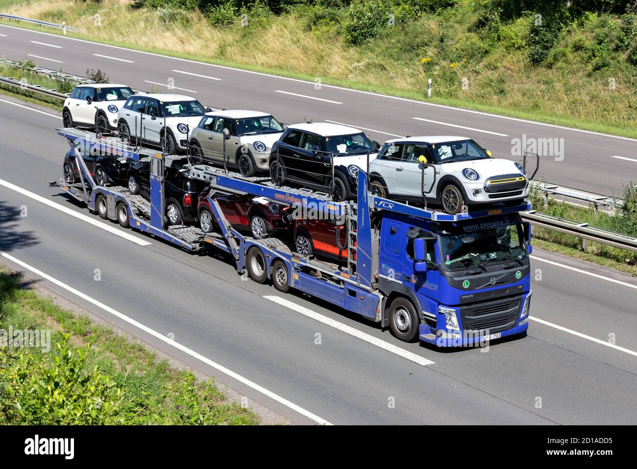 Beljana Volvo FM car-carrying truck on motorway. Stock Photo
