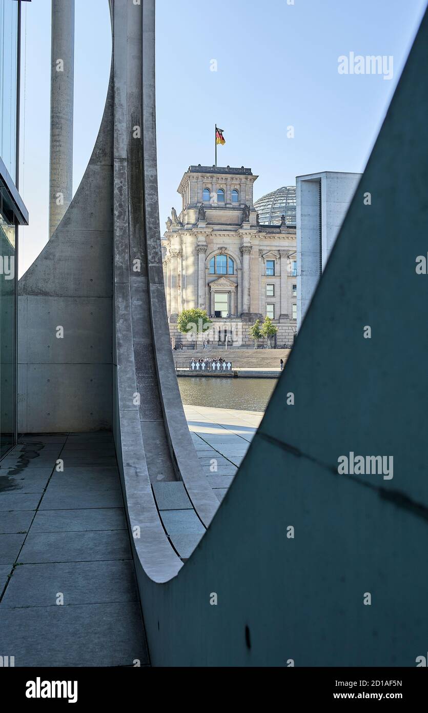 Part of the façade of the Marie Elisabeth Lüders Haus with the Reichstag building next to the river Spree in the background at the Berlin's government Stock Photo