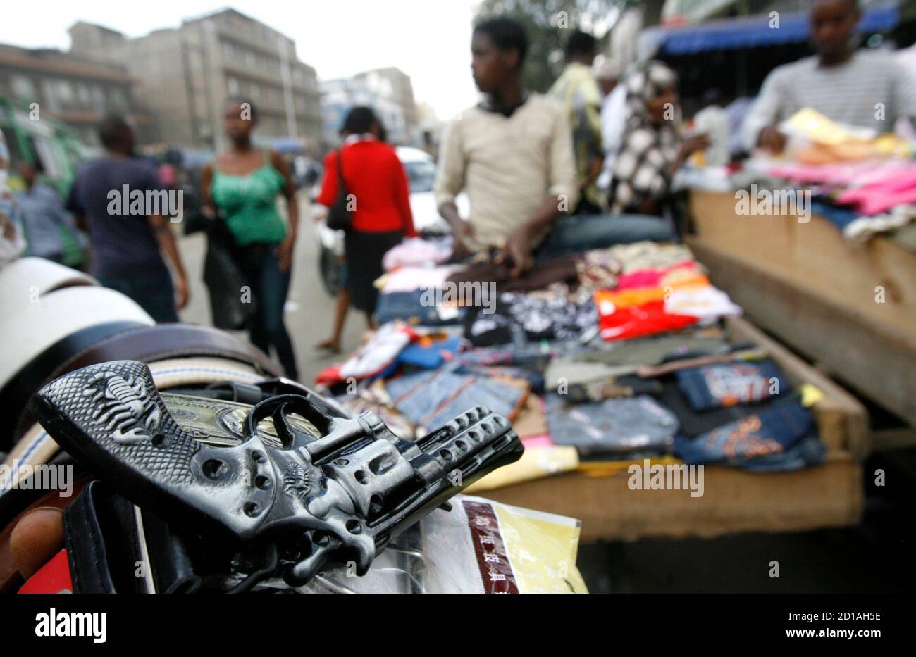 A belt buckle, resembling a pistol, is seen for sale in the Eastleigh neighbourhood of Nairobi, June 25, 2009. The bustling Eastleigh suburb has been the hub of business for Kenyan-Somalis and thousands of refugees escaping civil war in neighbouring Somalia for decades. But as people flee the continuing conflict in Somalia, the population is outgrowing Eastleigh's 'Little Mogadishu' and Somalis are venturing into other parts of the city. Picture taken June 25, 2009. REUTERS/Thomas Mukoya (KENYA SOCIETY CONFLICT BUSINESS) Stock Photo