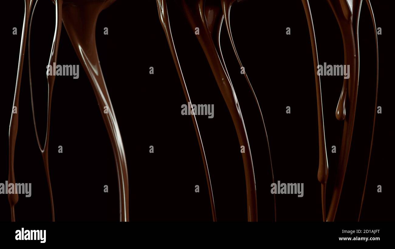 Splashing melted chocolate isolated on black background Stock Photo