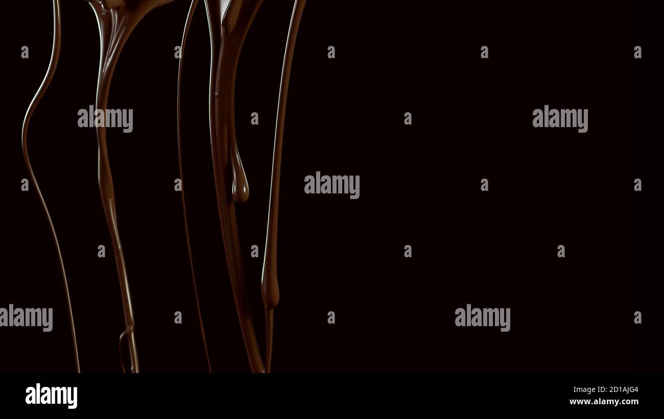 Splashing melted chocolate isolated on black background Stock Photo