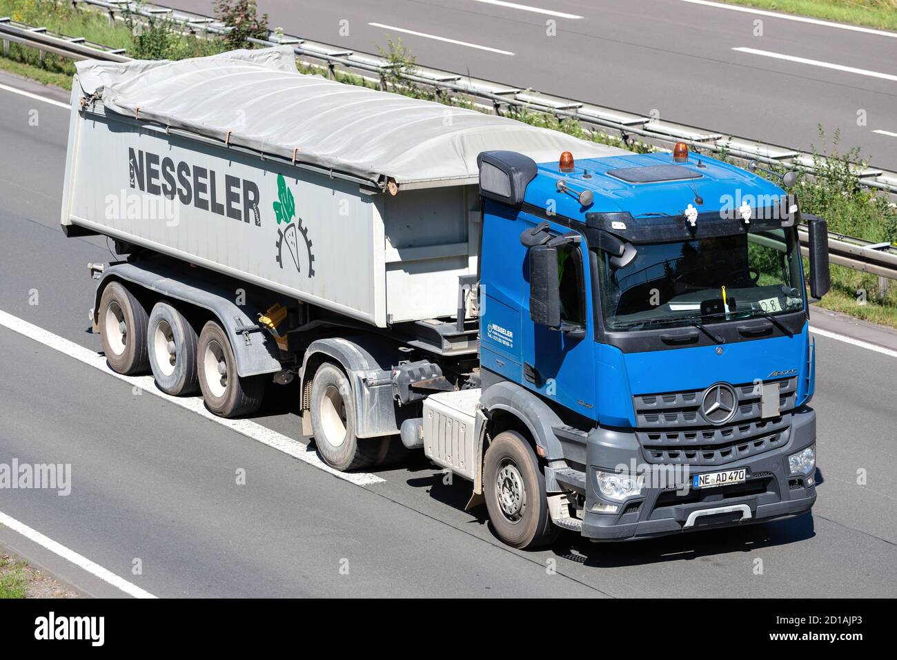 Nesseler Mercedes-Benz Actros truck with tipper trailer on motorway. Stock Photo