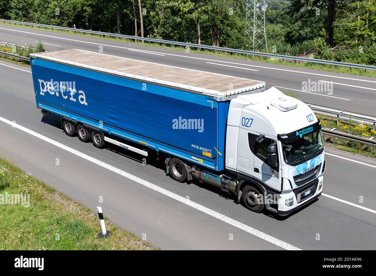 pe.tra Iveco Stralis truck with tarpaulin trailer on motorway. Stock Photo