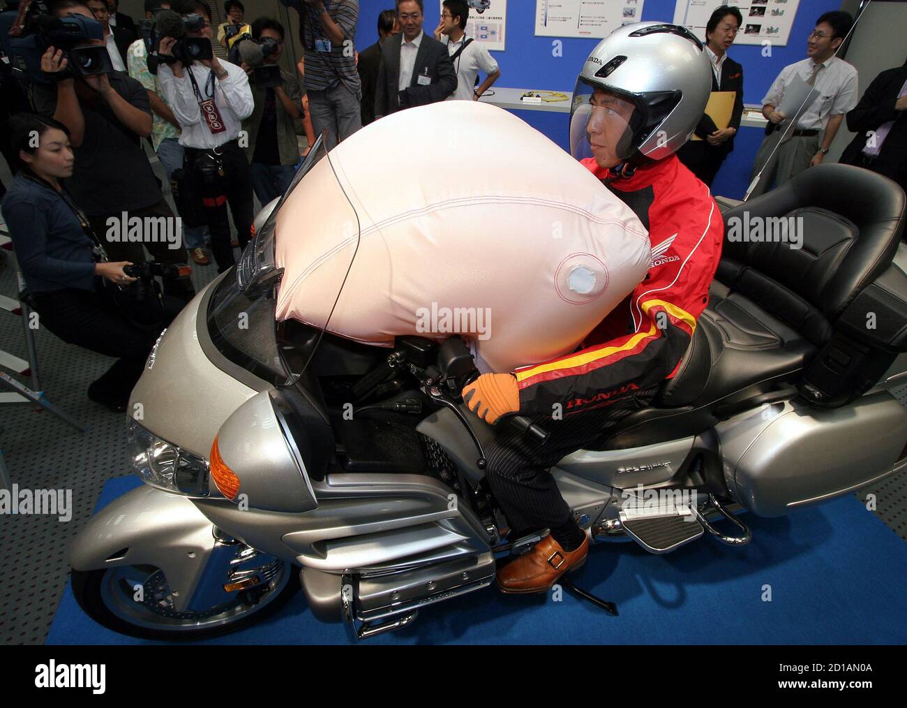 Honda Motor shows world's first airbag system to be mounted on production  model motorcycle at Honda headquarters in Tokyo. Honda Motor shows the  world's first airbag system to be mounted on a