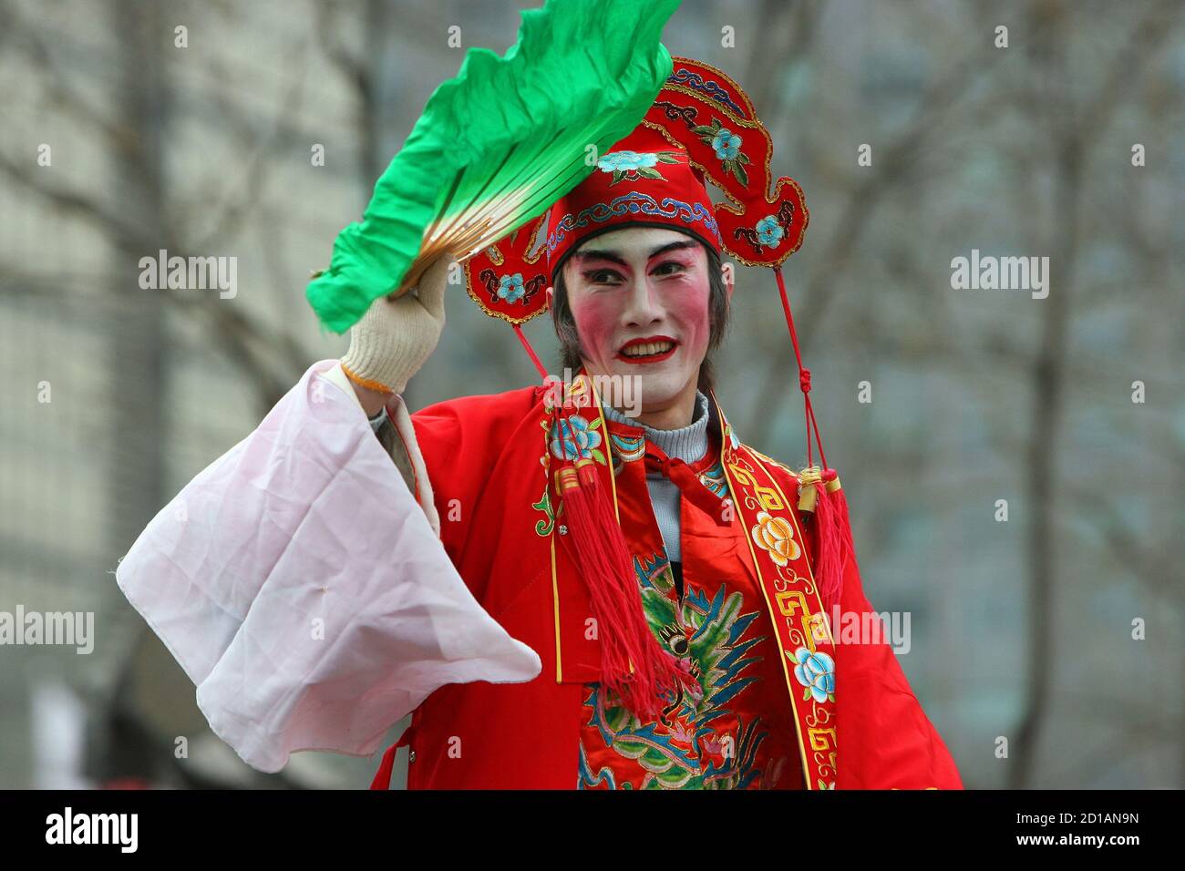 A Chinese artiste performs during a temple fair in Beijing January 30, 2006. China marked the start of the Year of the Dog on Sunday with [fireworks and dumplings, as the biggest holiday in the Chinese world reached a crescendo.] Stock Photo