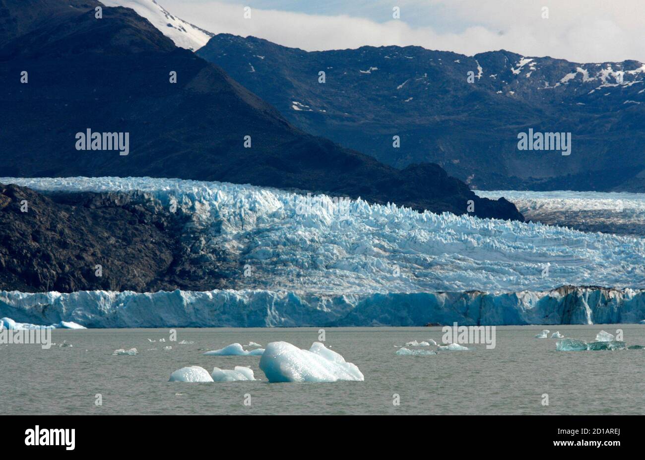 Blocks of ice broken off from the Upsala glacier in the back float on the  waters of Lago Argentino in the Parque Nacional Los Glaciares, southwest of  Argentina in the Patagonian province