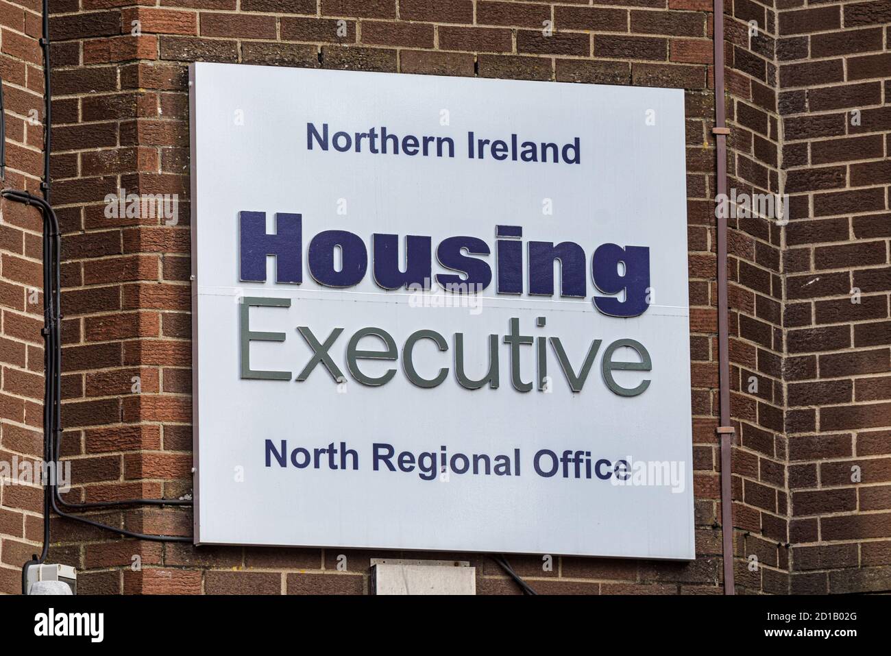 Derry, Northern Ireland- Sept 27, 2020: The sign for Northern Ireland Housing Executive in Derry. Stock Photo