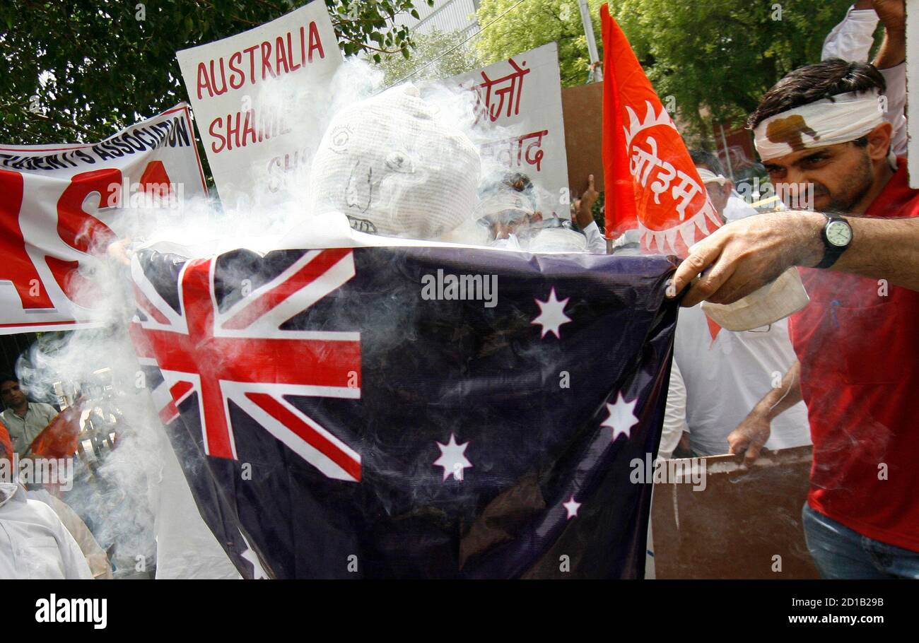 Members of the National Arya Student Association (NASA) burn an effigy and an Australian national during a protest recent attacks on Indian students in Australia, in New Delhi June