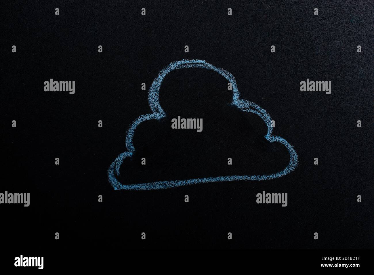 Closeup of a cloud drawing with chalk on a blackboard perfect for