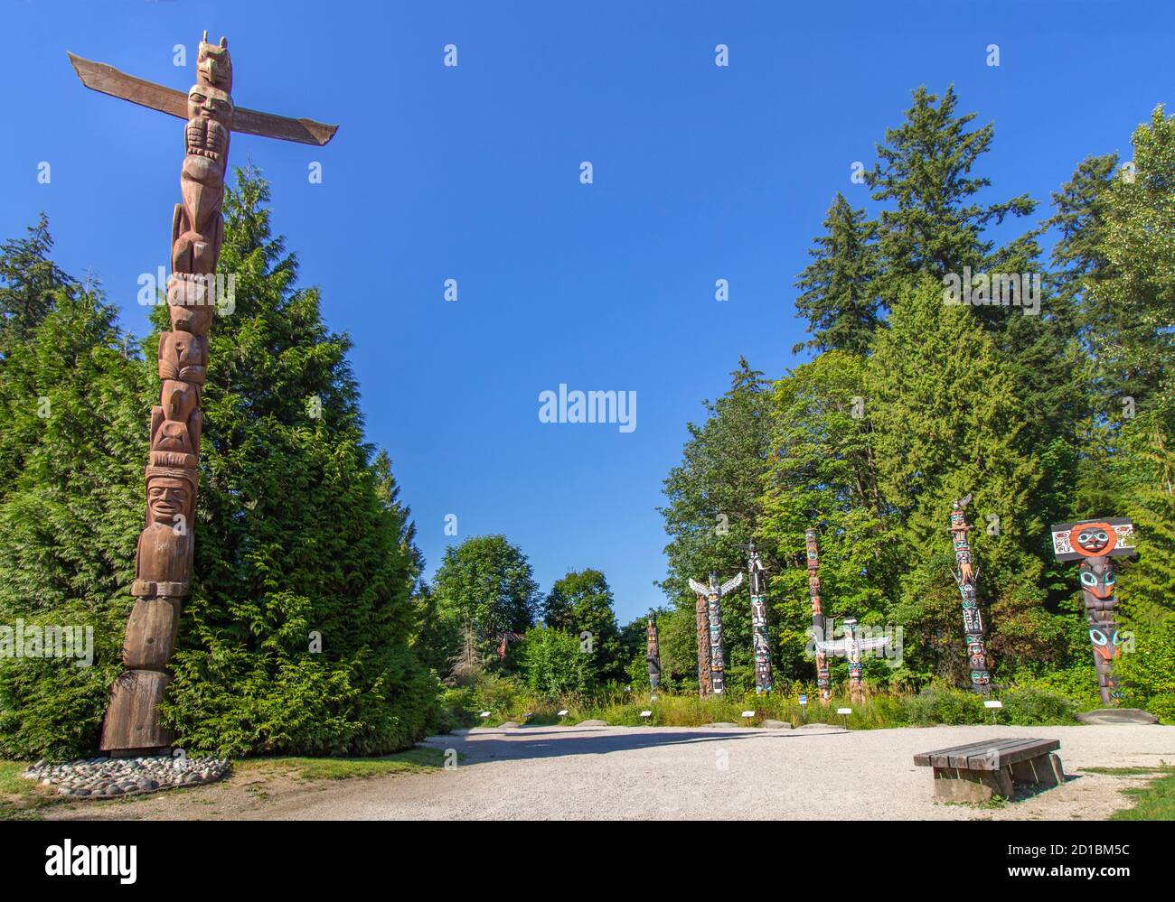 The famous Indigenous / Native artwork in Stanley park, Vancouver, BC. The entrance pole and seven monumental wooden carved and painted totem poles. Stock Photo