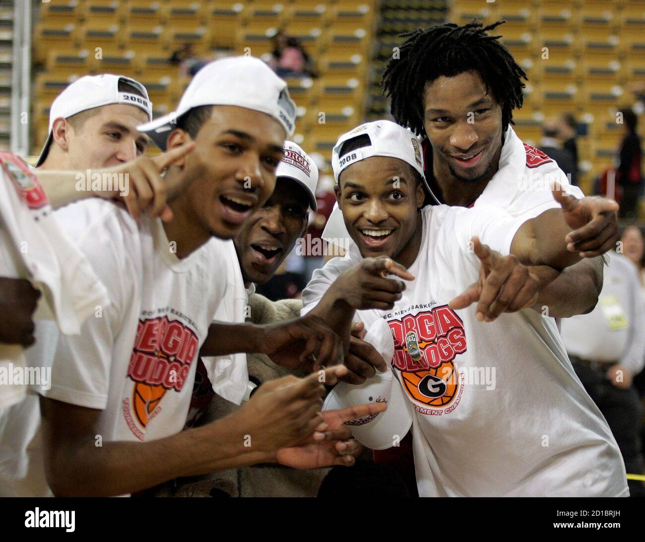 University of Georgia's players celebrate after their win over Arkansas for the Southeastern Conference title at their NCAA basketball game in Atlanta, Georgia March 16, 2008. REUTERS/Tami Chappell (UNITED STATES) Stock Photo