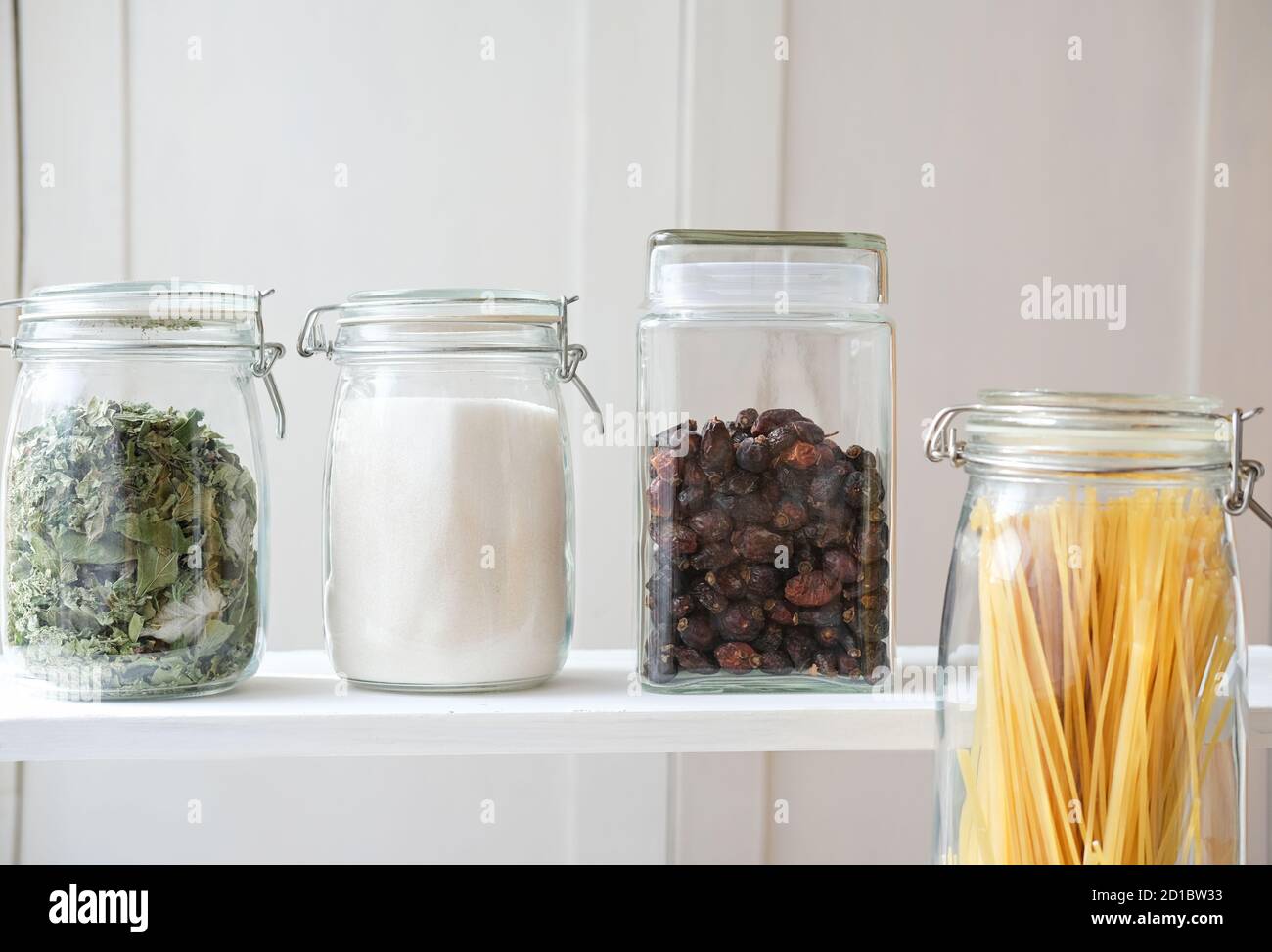 glass jars for kitchen grocery storage. pasta, sugar, herbs and