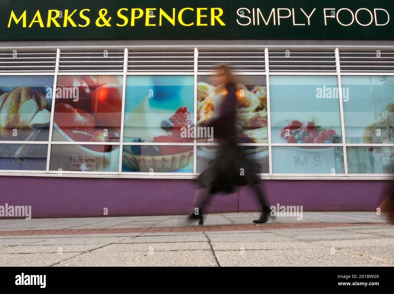 A Woman Walks Past A Marks And Spencer Food Store In Loughborough Central England November 3 2008 Marks Spencer Plc Britain S Biggest Clothing Retailer Posted A 34 Percent Drop In First Half