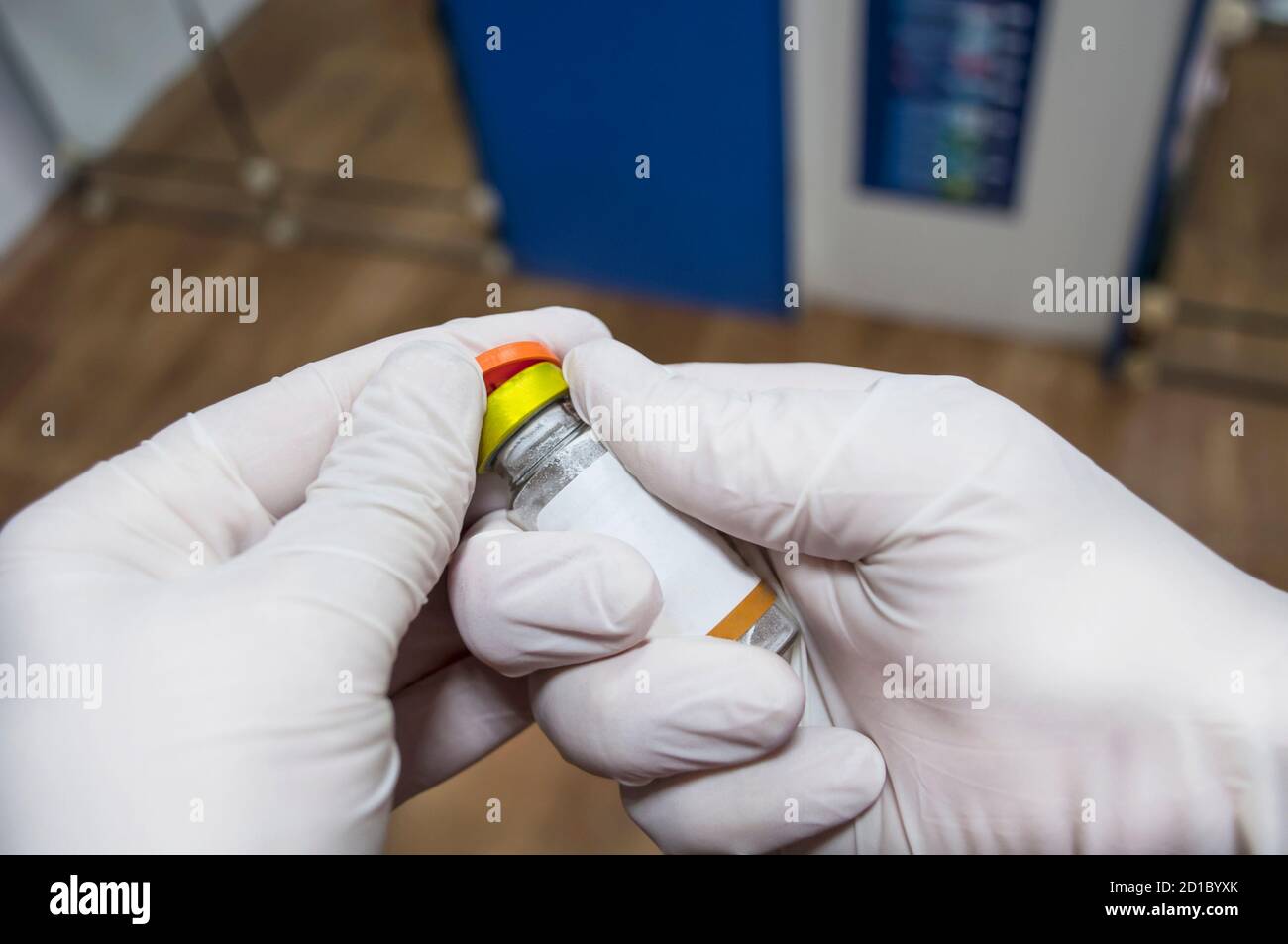 You can see hands in white gloves, which begins to open the ampoulecloseup. Vaccination and immunization Stock Photo