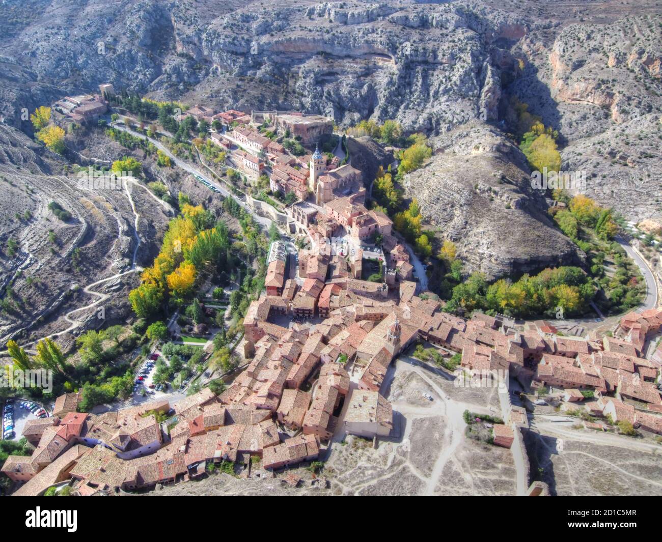 Aerial wide shot of a town in the middle of mountains Stock Photo - Alamy