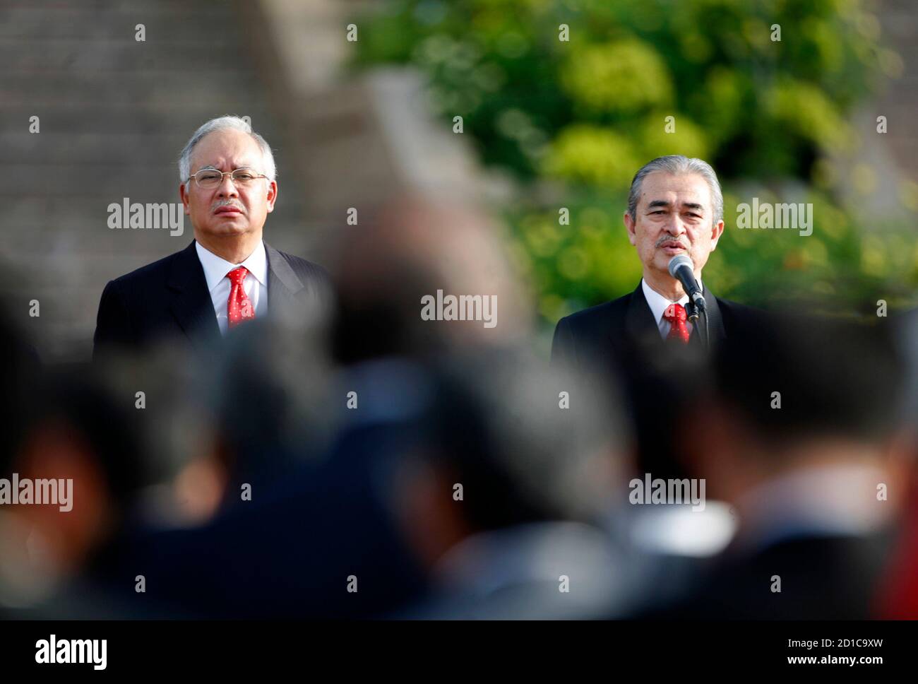 Malaysia's prime minister-in-waiting Najib Razak (L) listens to Prime Minister Abdullah Ahmad Badawi during a Prime Minister Department gathering in Putrajaya, outside Kuala Lumpur December 1, 2008. Abdullah is to step down in March next year and he has endorsed Najib as his successor. REUTERS/Bazuki Muhammad (MALAYSIA) Stock Photo