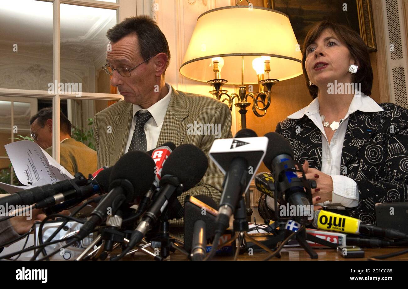 Marie-Christine Chastant-Morand (R) and Thierry Moser, lawyers of Christine and Jean-Marie Villemin, parents of murdered 4-year-old Gregory, hold a news conference in Paris October 22, 2009 about the DNA traces from a man and a woman which were found on a threatening anonymous letter in 'the Gregory Affair'. French detectives have found DNA traces from the child murder case of Gregory Villemin, a 4-year-old boy, who was found dead with his feet and hands bound in a river near his home in eastern France.    REUTERS/Philippe Wojazer  (FRANCE CRIME LAW) Stock Photo