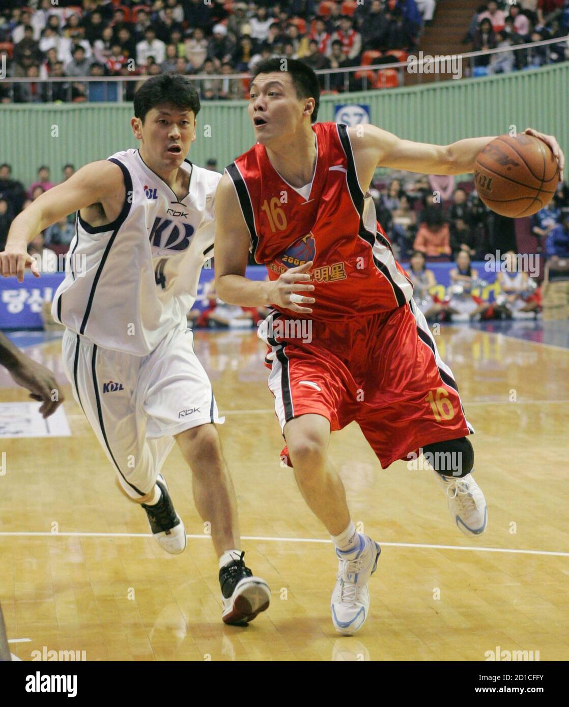 Zhang Cheng (R) from China's Continental Basketball Association (CBA)  drives the ball past Choo Seung-gyun from South Korea's Korean Basketball  League (KBL) during the All-Star team friendly basketball match in Seoul  January
