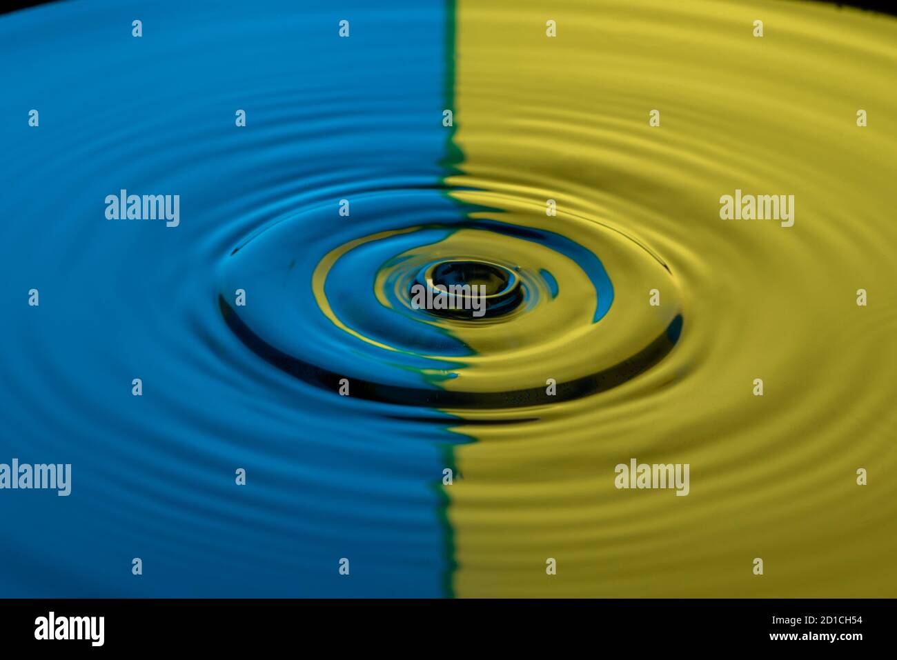 Drop photography in a water basin with flash system and colorful ...