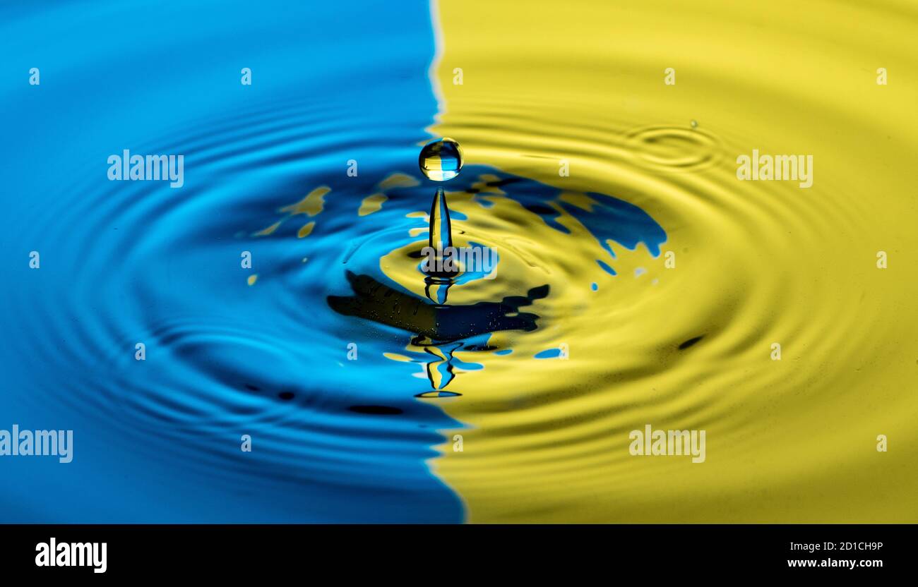 Drop photography in a water basin with flash system and colorful ...