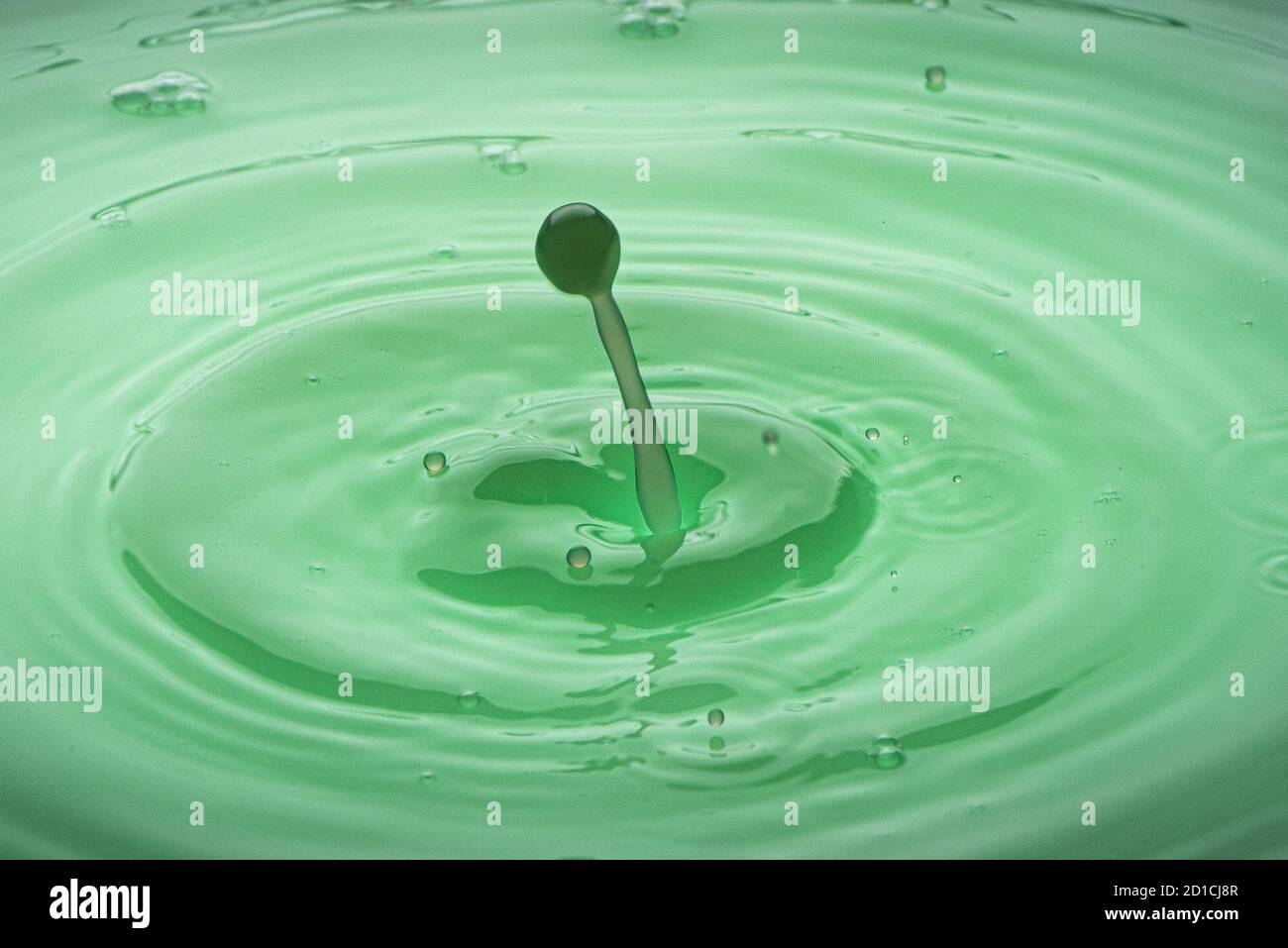 Drop photography in a water basin with flash system and colorful ...