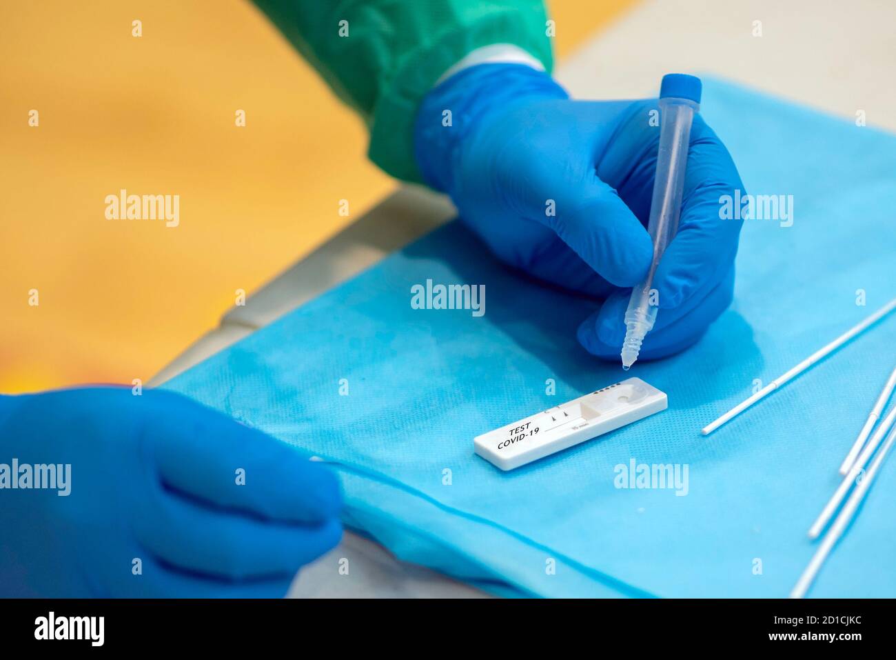 Hands of health personnel testing for viruses Stock Photo