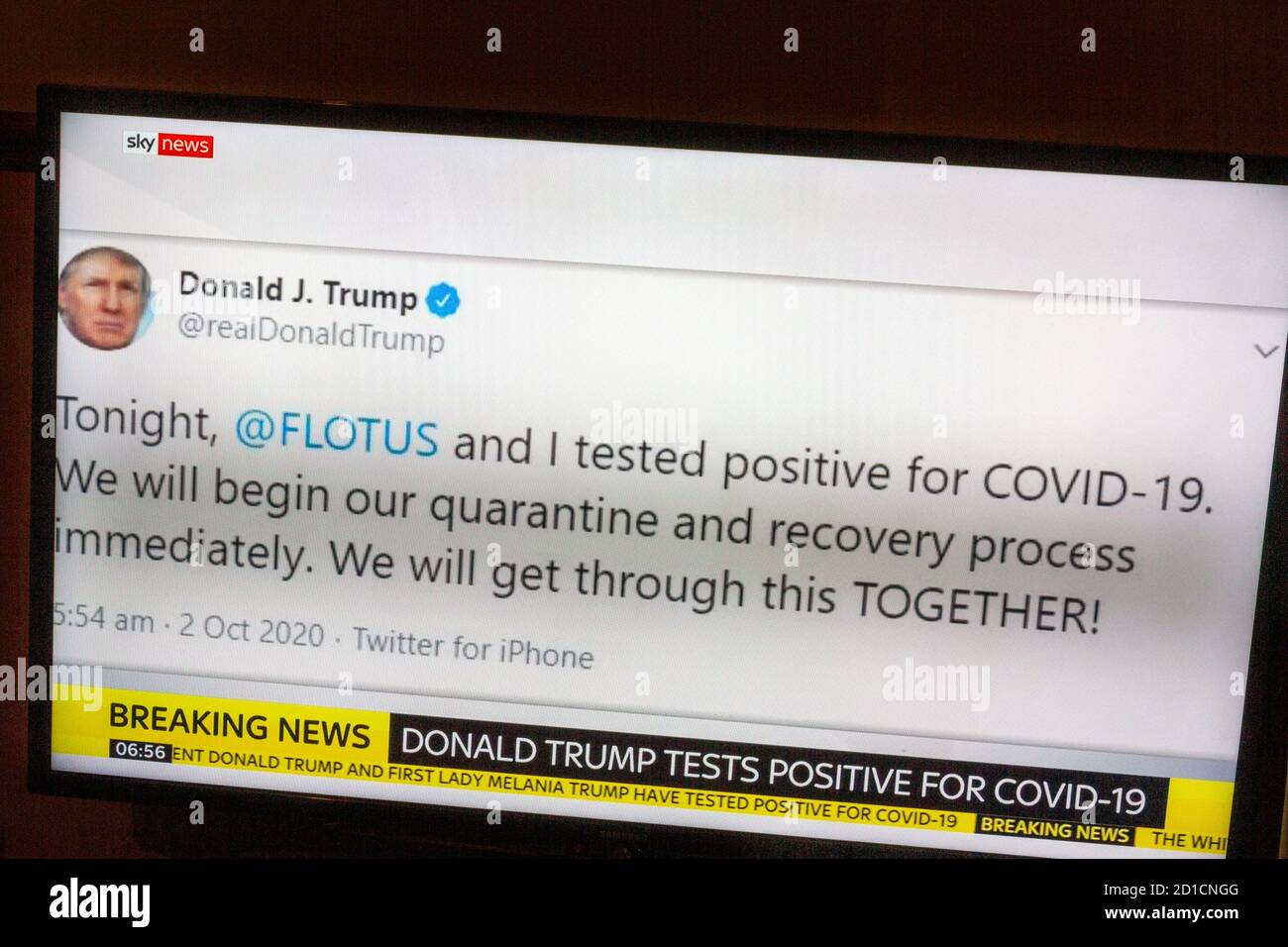 Photo of TV screen showing Sky News breaking news with tweet from US President Donald Trump that he had tested positive for Covid-19, 2nd Oct 2020. Stock Photo