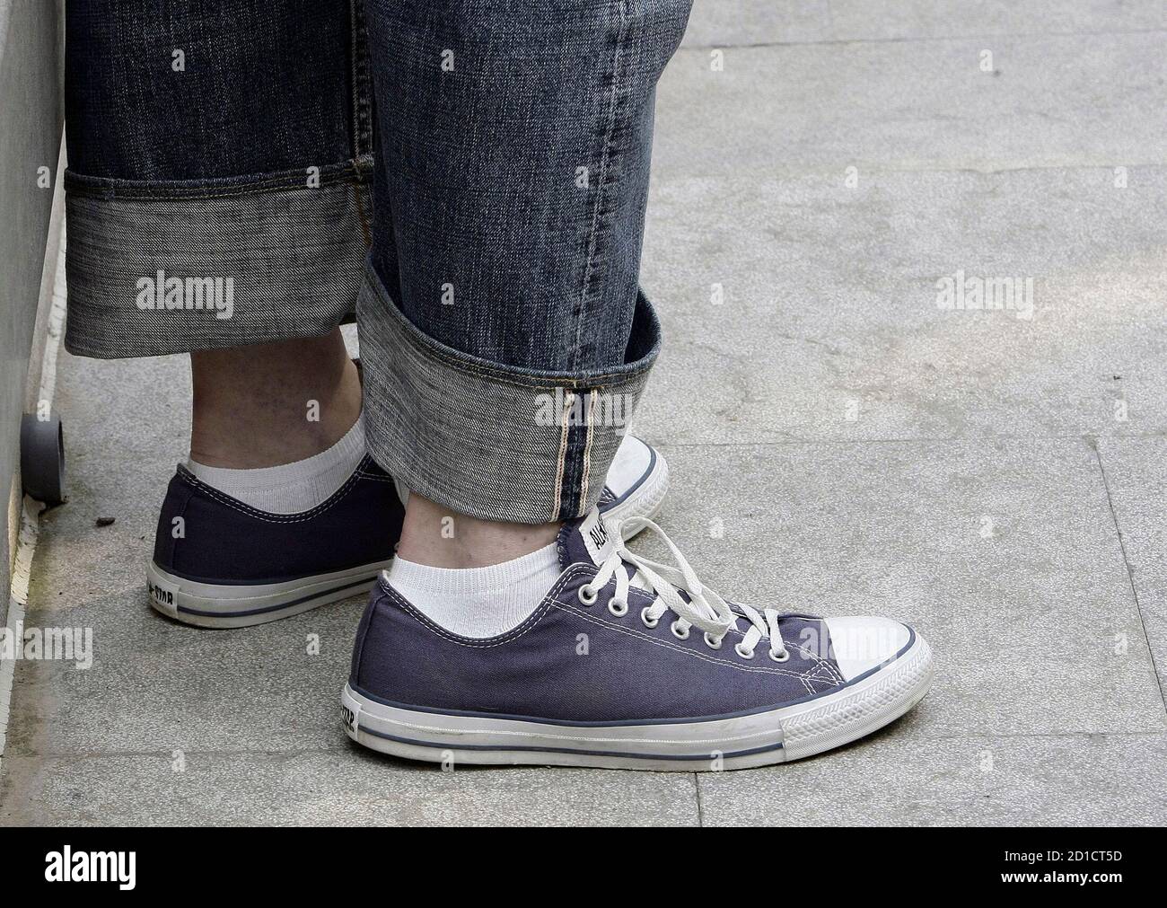 The shoes of actor John Malkovich are seen as he poses for photographers  before a news conference to present the inaugural concert 