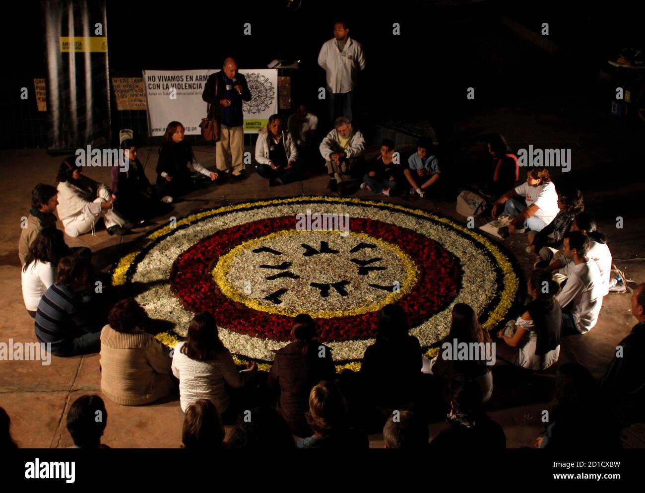 People Gather Around A Circle Made Out Of Flower Petals During An Amnesty International Demonstration Against Armed Violence In Lima May 11 10 About 100 Protesters Gathered Around The Circle Of Flowers