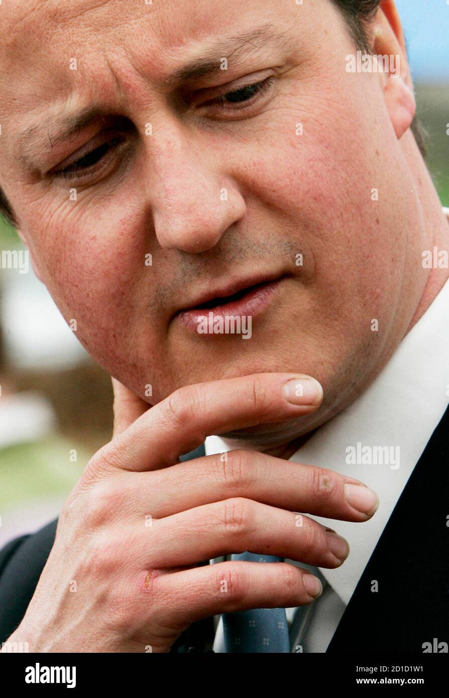 Britain's opposition Conservative Party leader David Cameron reacts  while addressing journalists in Gretna, Scotland April 19, 2007. Cameron joined Northern Ireland politician David Trimble and Scottish Conservative Party leader Annabel Goldie at various sites around Dumfrieshire whilst campaigning ahead of the forthcoming Scottish Parliamentary elections. REUTERS/David Moir (BRITAIN) Stock Photo