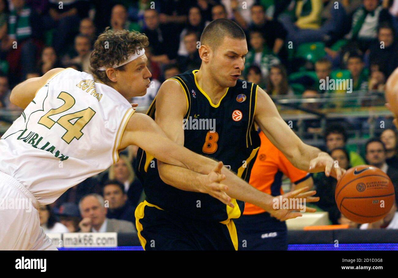 Olimpia's Miha Zupan (24) challenges Filip Dylewicz of Prokom Trefl Sopot  during their Euroleague Group A basketball match in Ljubljana December 6,  2007. REUTERS/Srdjan Zivulovic (SLOVENIA Stock Photo - Alamy