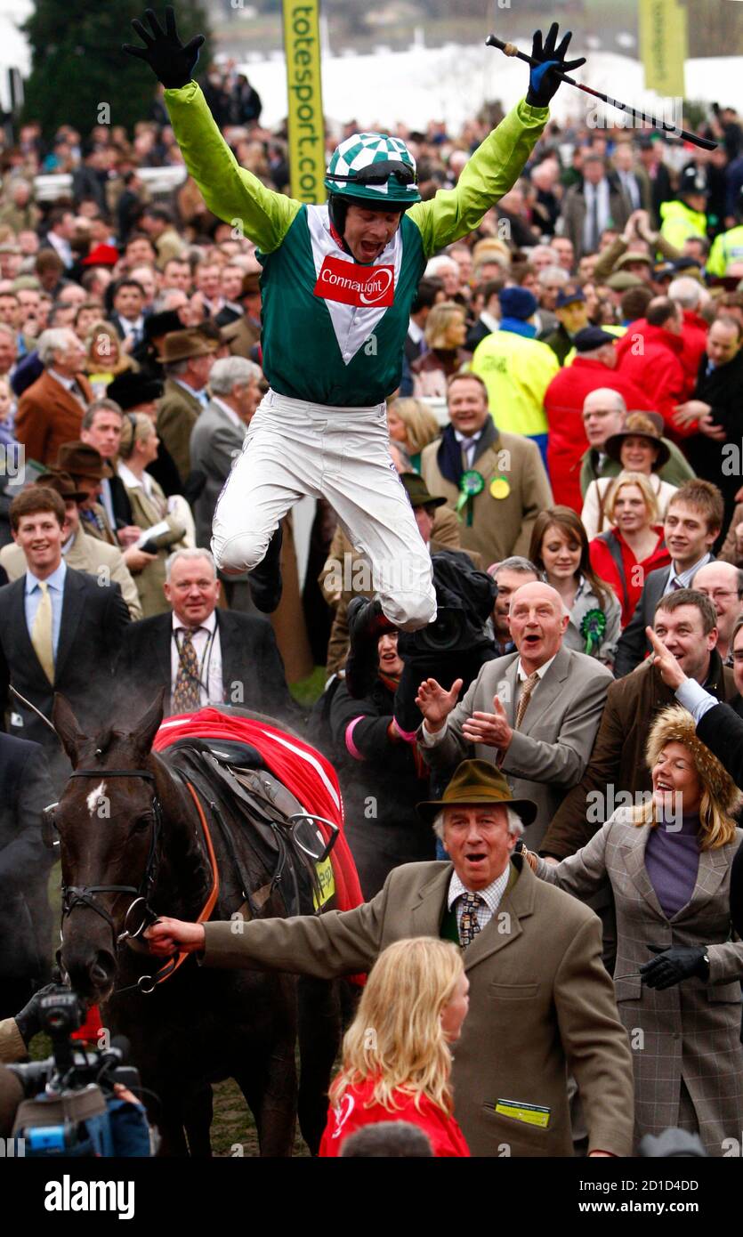 Sam Thomas on Denman celebrates winning the totesport Cheltenham Gold Cup Steeple Chase on the forth day of the Cheltenham Festival horse racing meet in Gloucestershire, western England, March 14, 2008. REUTERS/Eddie Keogh (BRITAIN) Stock Photo