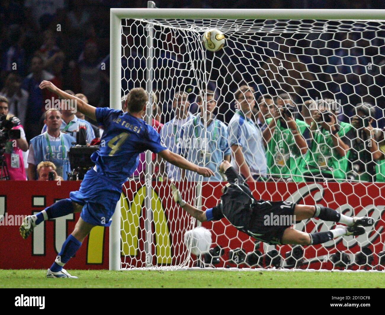 Italy S Daniele De Rossi L Scores A Goal Past France S Goalkeeper Fabien Barthez During The Penalty Shootout In The World Cup 06 Final Soccer Match Between Italy And France In Berlin July