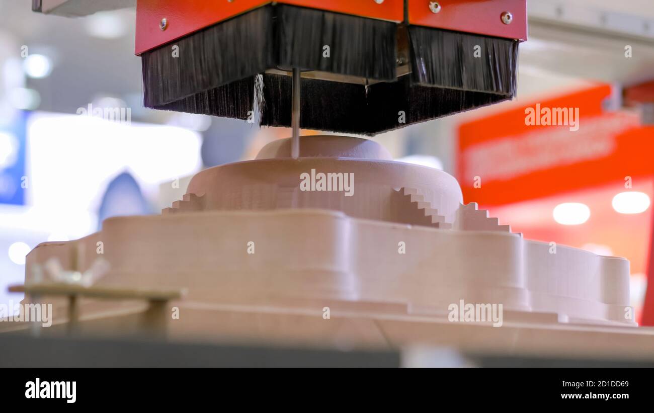 Automated milling machine cutting wooden workpiece from wood pulp