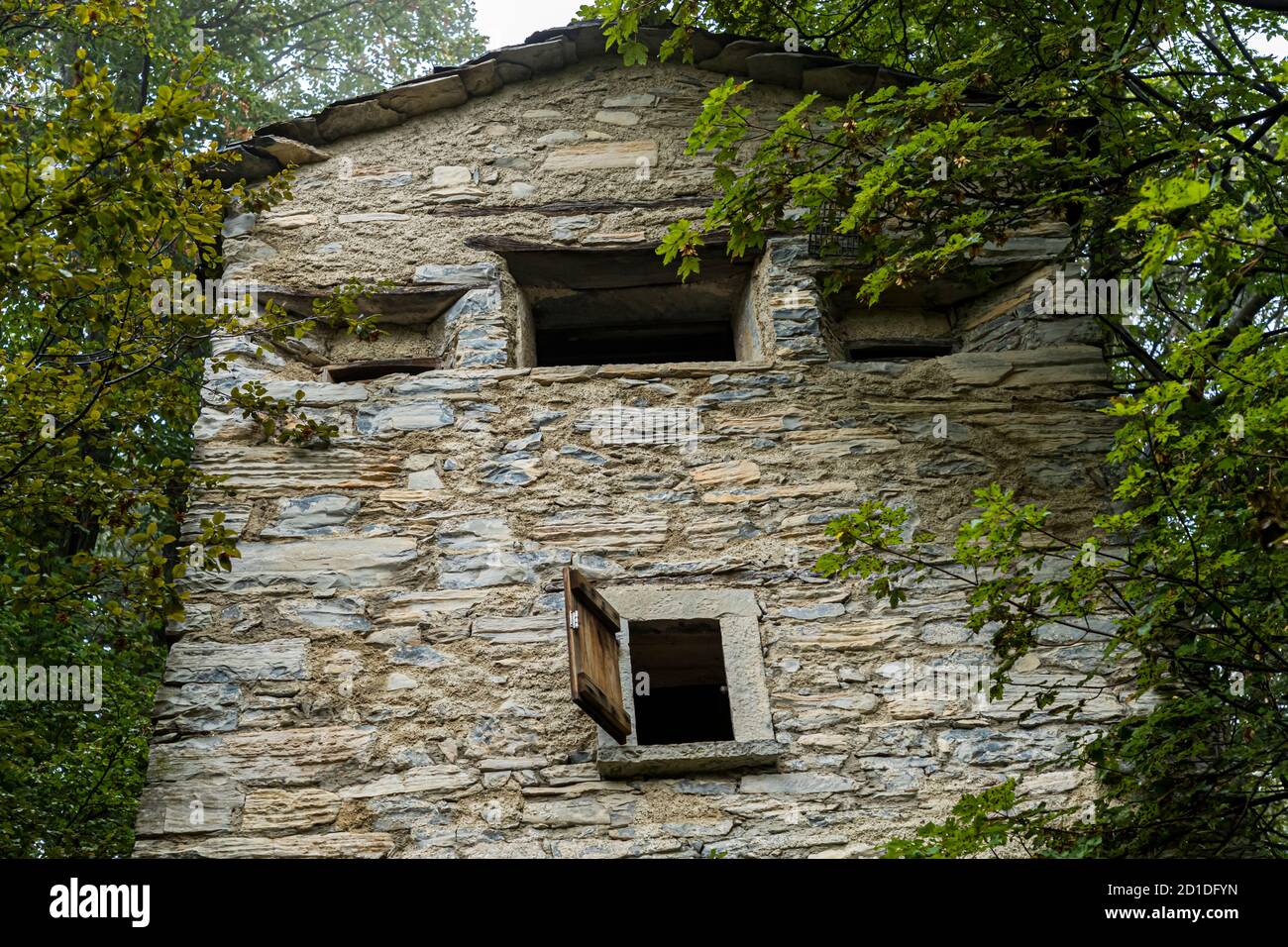 Hidden among the trees, at an altitude of 950 meters stands the Roccolo Meri, the bird tower of Scudellate. The tower has been restored and can also be visited at certain times. Roccolo in Scudelate, Ticino, Switzerland Stock Photo